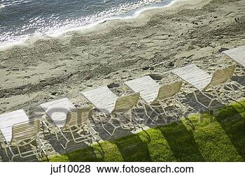 Stock Photo - aerial view of 
lawn chairs by 
beach. fotosearch 
- search stock 
photos, pictures, 
images, and photo 
clipart