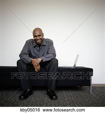 Stock Photo - african man with 
laptop smiling. 
fotosearch - search 
stock photos, 
pictures, images, 
and photo clipart