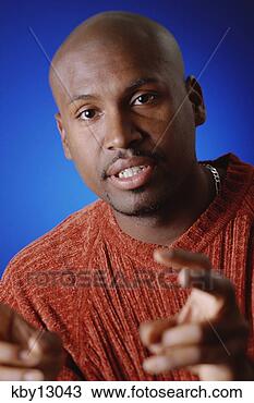 Stock Photo - african man making 
air quotes. fotosearch 
- search stock 
photos, pictures, 
images, and photo 
clipart