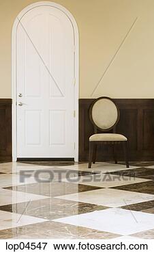 Picture - arched front door 
and chair. fotosearch 
- search stock 
photos, pictures, 
images, and photo 
clipart