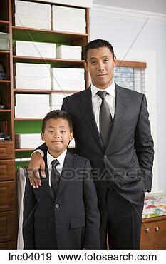 Stock Photograph - asian father and 
son wearing suits. 
fotosearch - search 
stock photos, 
pictures, images, 
and photo clipart