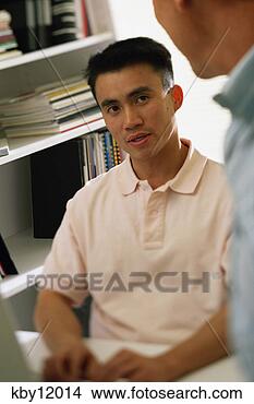 Stock Photo - asian man using 
computer and talking 
to colleague. 
fotosearch - search 
stock photos, 
pictures, images, 
and photo clipart
