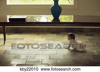 Stock Photography - baby girl crawling 
on tile. fotosearch 
- search stock 
photos, pictures, 
images, and photo 
clipart