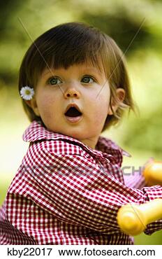 Picture - baby girl with 
daisy tucked behind 
her ear. fotosearch 
- search stock 
photos, pictures, 
images, and photo 
clipart