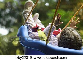 Stock Photograph - baby girl swinging 
in swing chair. 
fotosearch - search 
stock photos, 
pictures, images, 
and photo clipart