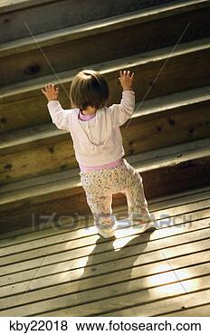 Stock Photo - baby girl taking 
her first steps. 
fotosearch - search 
stock photos, 
pictures, images, 
and photo clipart