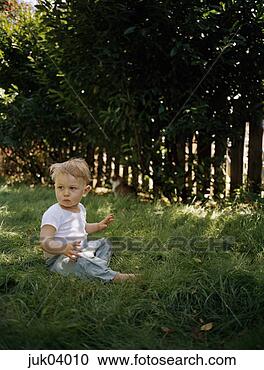 Stock Photography - baby sitting on 
grass in backyard. 
fotosearch - search 
stock photos, 
pictures, images, 
and photo clipart