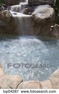 Picture - backyard jacuzzi 
with waterfall. 
fotosearch - search 
stock photos, 
pictures, images, 
and photo clipart