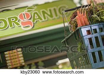 Stock Photography - basket in organic 
produce aisle 
of grocer store. 
fotosearch - search 
stock photos, 
pictures, images, 
and photo clipart