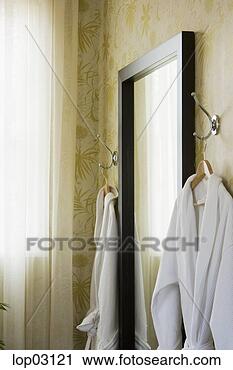 Stock Photography - bathrobes hanging 
by mirror. fotosearch 
- search stock 
photos, pictures, 
images, and photo 
clipart