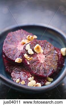 Stock Photography - blood orange slices 
and nuts. fotosearch 
- search stock 
photos, pictures, 
images, and photo 
clipart