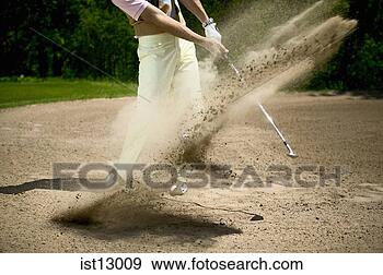 Stock Photograph - blurred motion 
of man swinging 
out of bunker. 
fotosearch - search 
stock photos, 
pictures, images, 
and photo clipart