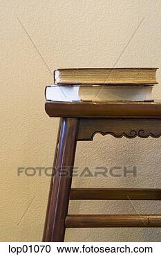 Stock Photography - books on stool. 
fotosearch - search 
stock photos, 
pictures, images, 
and photo clipart