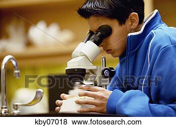 Stock Photo - boy looking through 
microscope. fotosearch 
- search stock 
photos, pictures, 
images, and photo 
clipart