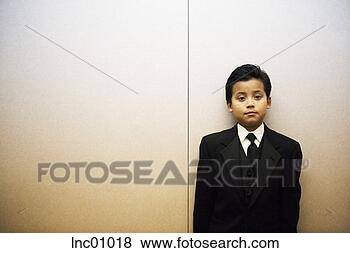 Stock Photo - boy wearing a 
suit. fotosearch 
- search stock 
photos, pictures, 
images, and photo 
clipart