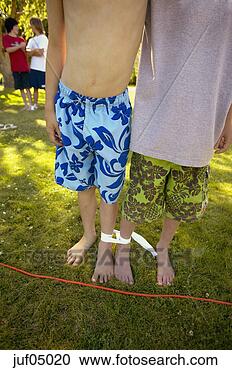 Stock Photography - boys participating 
in three-legged 
race. fotosearch 
- search stock 
photos, pictures, 
images, and photo 
clipart