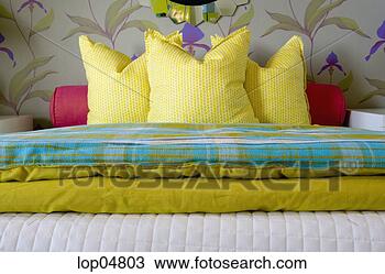 Stock Photo - brightly colored 
pillows on bed. 
fotosearch - search 
stock photos, 
pictures, images, 
and photo clipart