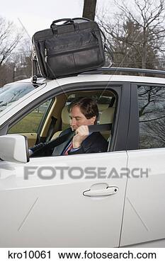 Stock Photography - businessman buckling 
his seatbelt. 
fotosearch - search 
stock photos, 
pictures, images, 
and photo clipart