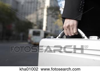 Stock Photo - businessman carrying 
metal briefcase. 
fotosearch - search 
stock photos, 
pictures, images, 
and photo clipart