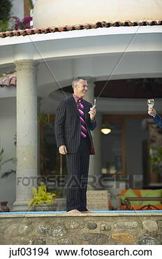 Stock Photo - businessman using 
cell phone. fotosearch 
- search stock 
photos, pictures, 
images, and photo 
clipart