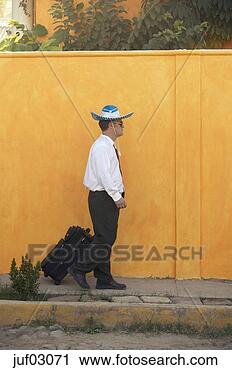 Stock Photography - businessman wearing 
sunglasses and 
sombrero wheeling 
suitcase. fotosearch 
- search stock 
photos, pictures, 
images, and photo 
clipart