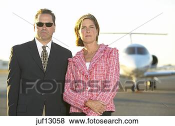 Stock Photo - businesspeople 
standing on runway. 
fotosearch - search 
stock photos, 
pictures, images, 
and photo clipart