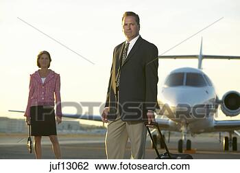 Stock Photo - businesspeople 
standing on runway. 
fotosearch - search 
stock photos, 
pictures, images, 
and photo clipart