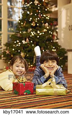 Stock Photography - children with 
christmas presents. 
fotosearch - search 
stock photos, 
pictures, images, 
and photo clipart