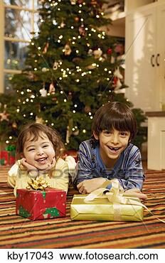 Stock Photo - children with 
christmas presents. 
fotosearch - search 
stock photos, 
pictures, images, 
and photo clipart