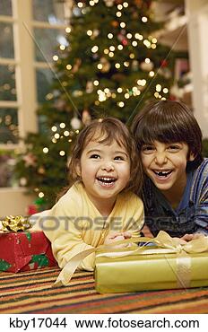 Stock Photo - children with 
christmas presents. 
fotosearch - search 
stock photos, 
pictures, images, 
and photo clipart