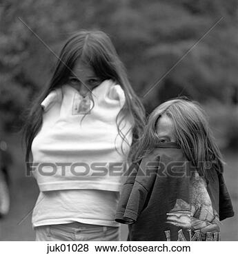 Stock Photo - children holding 
arms inside shirts 
to keep warm. 
fotosearch - search 
stock photos, 
pictures, images, 
and photo clipart