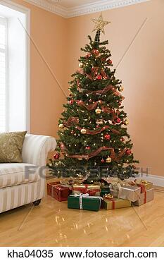 Stock Image - christmas tree 
and presents. 
fotosearch - search 
stock photos, 
pictures, images, 
and photo clipart