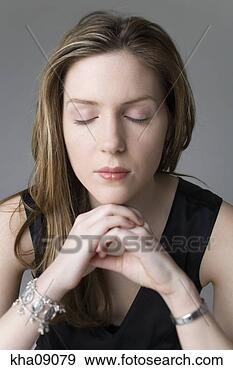 Stock Photograph - close up of young 
woman with eyes 
closed. fotosearch 
- search stock 
photos, pictures, 
images, and photo 
clipart