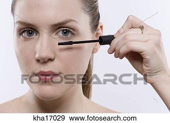 Stock Photograph - close up of young 
woman with mascara 
wand. fotosearch 
- search stock 
photos, pictures, 
images, and photo 
clipart