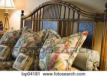 Stock Photography - colorful bed linens 
on wood and iron 
headboard. fotosearch 
- search stock 
photos, pictures, 
images, and photo 
clipart