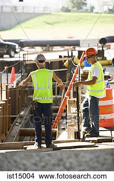 Stock Photo - construction workers 
looking at site. 
fotosearch - search 
stock photos, 
pictures, images, 
and photo clipart