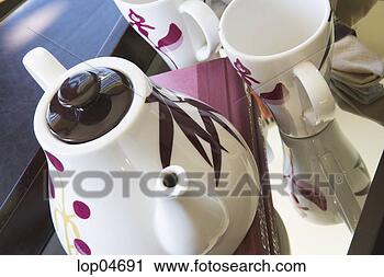 Stock Photography - contemporary teapot 
with purple flowers. 
fotosearch - search 
stock photos, 
pictures, images, 
and photo clipart