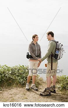 Stock Photo - couple holding 
hands. fotosearch 
- search stock 
photos, pictures, 
images, and photo 
clipart