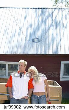 Stock Photo - couple leaning 
against pick-up 
truck. fotosearch 
- search stock 
photos, pictures, 
images, and photo 
clipart