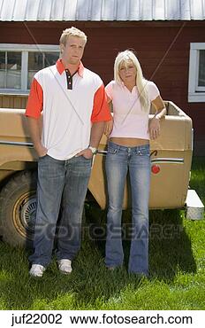 Stock Photo - couple leaning 
against pick-up 
truck. fotosearch 
- search stock 
photos, pictures, 
images, and photo 
clipart