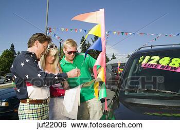 Stock Photo - couple signing 
contracts to buy 
used car. fotosearch 
- search stock 
photos, pictures, 
images, and photo 
clipart