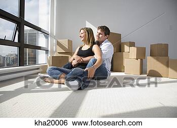 Stock Photo - couple sitting 
with unpacked 
boxes in new home. 
fotosearch - search 
stock photos, 
pictures, images, 
and photo clipart