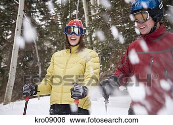 Stock Photo - couple spraying 
snow while cross-country 
skiing. fotosearch 
- search stock 
photos, pictures, 
images, and photo 
clipart