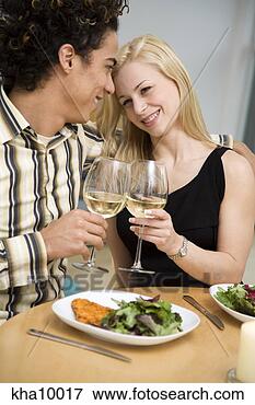 Picture - couple toasting 
with wine over 
dinner. fotosearch 
- search stock 
photos, pictures, 
images, and photo 
clipart