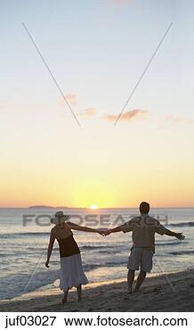Picture - couple walking 
on beach. fotosearch 
- search stock 
photos, pictures, 
images, and photo 
clipart
