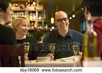 Stock Photograph - couples at dinner. 
fotosearch - search 
stock photos, 
pictures, images, 
and photo clipart