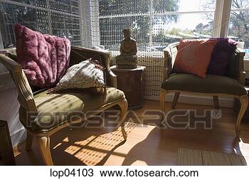Stock Photo - cozy sitting room 
with buddha statue. 
fotosearch - search 
stock photos, 
pictures, images, 
and photo clipart