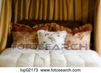 Stock Photo - cushions on bed. 
fotosearch - search 
stock photos, 
pictures, images, 
and photo clipart