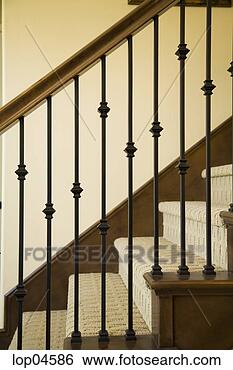 Stock Photo - detail of wraight 
iron and wood 
railing. fotosearch 
- search stock 
photos, pictures, 
images, and photo 
clipart