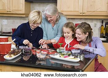 Stock Photo - family making 
christmas cookies. 
fotosearch - search 
stock photos, 
pictures, images, 
and photo clipart